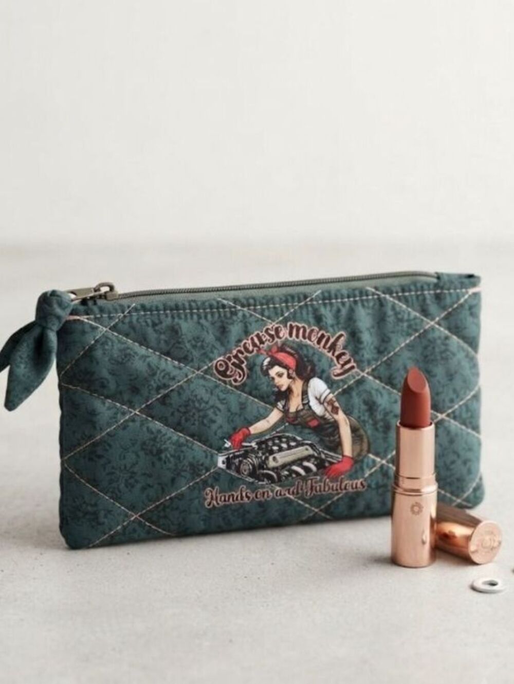 Grease Monkey fab girl Quilted bow pouch on forest green floral fabric girlpower